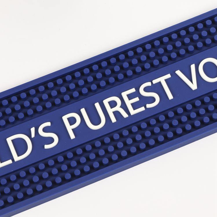 Custom LED Bar Spill Mat Battery Operated Illuminated Waterproof Non-Slip Spill Control Bar Runner, close up embossed World’s Purest Vodka text logo on blue silicone non-slip nub surface
