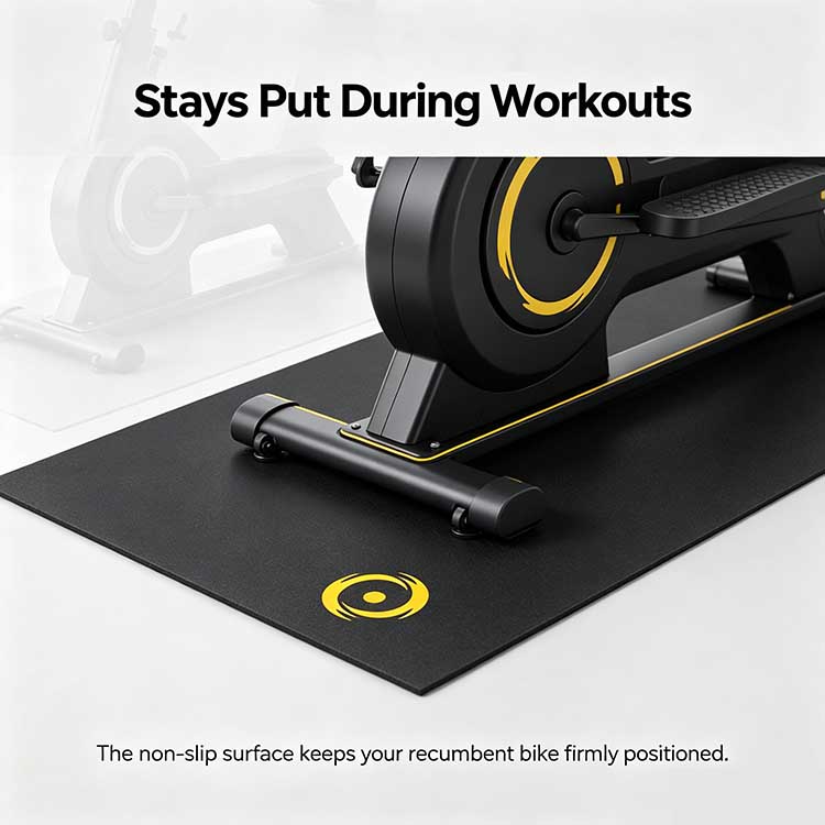 Close-up of a non-slip recumbent bike mat anchoring the machine's stabilizer to prevent shifting.