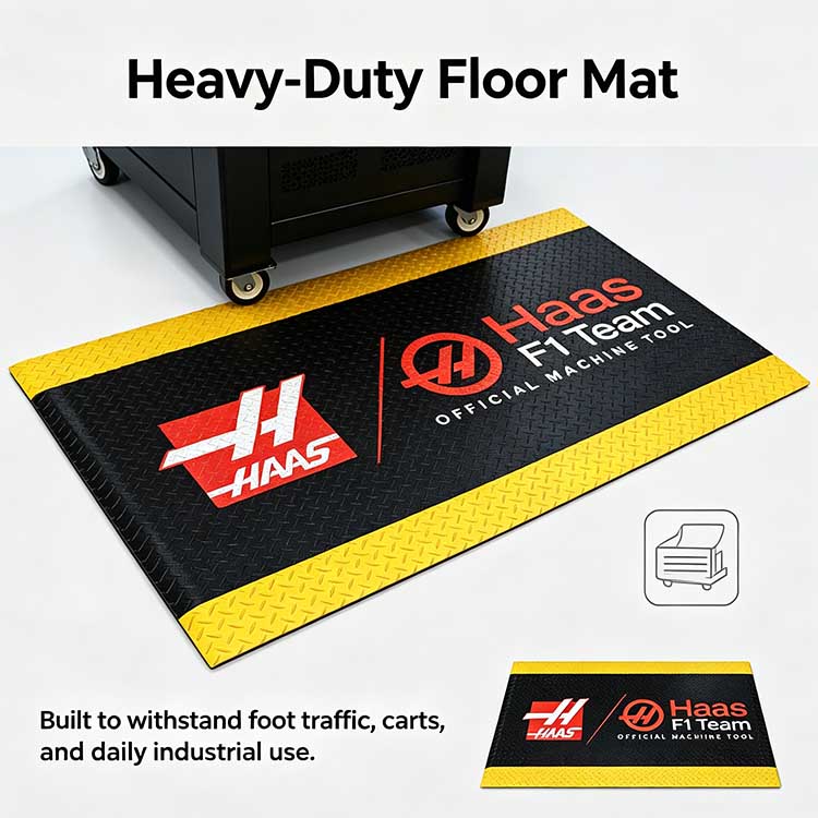 Heavy-duty 15.875mm industrial floor mat supporting a rolling tool cart without curling.