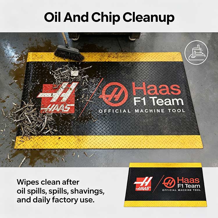 Industrial floor mat repelling heavy oil and metal shavings, effortlessly wiped clean with a brush.