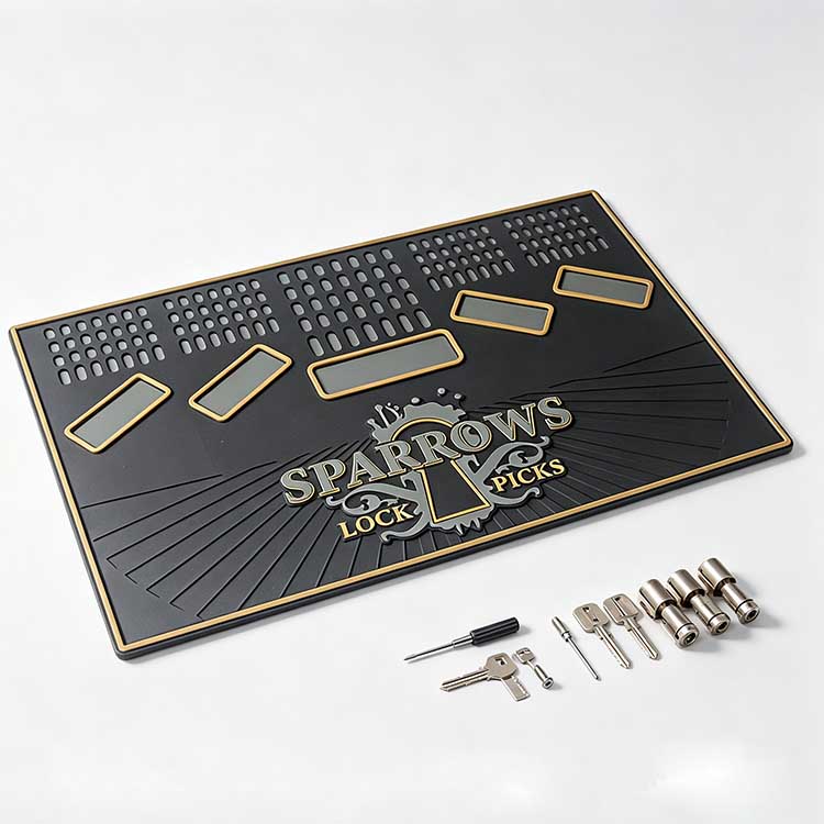 Rubber lock picking work mat with upright pick stand matrix for locksmiths.