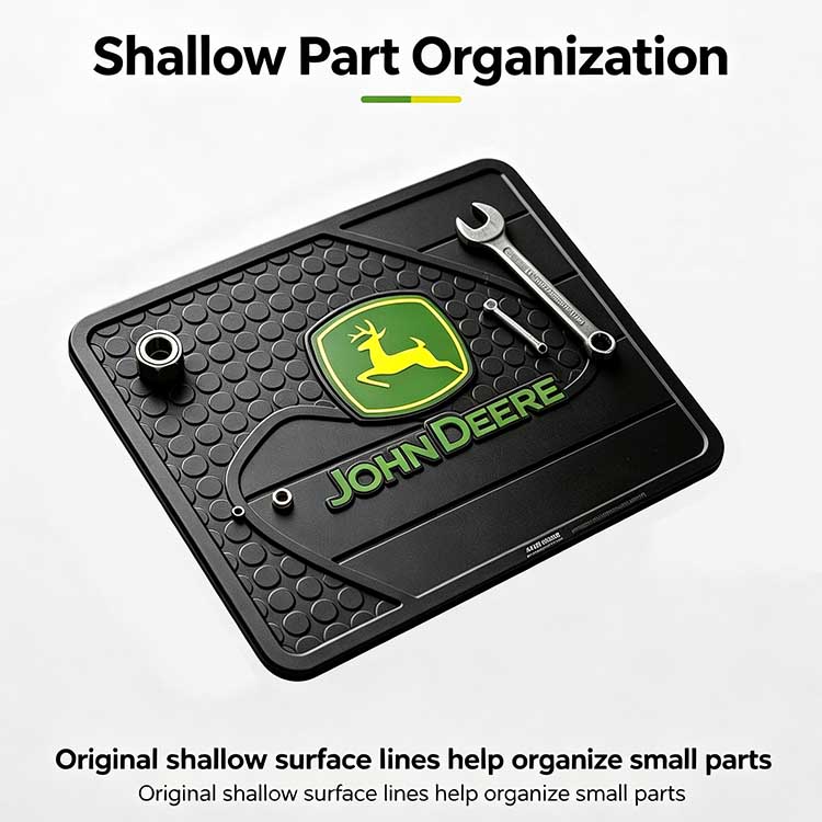 Shallow part organization tray on a maintenance mat for sorting tractor bolts.