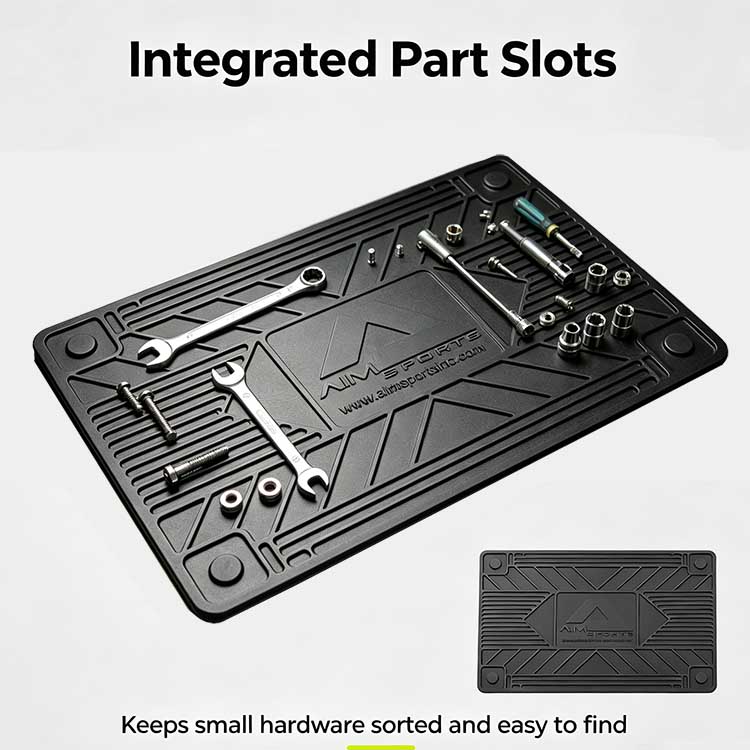 Four corner recesses on a workstation mat sorting small screws and bearings