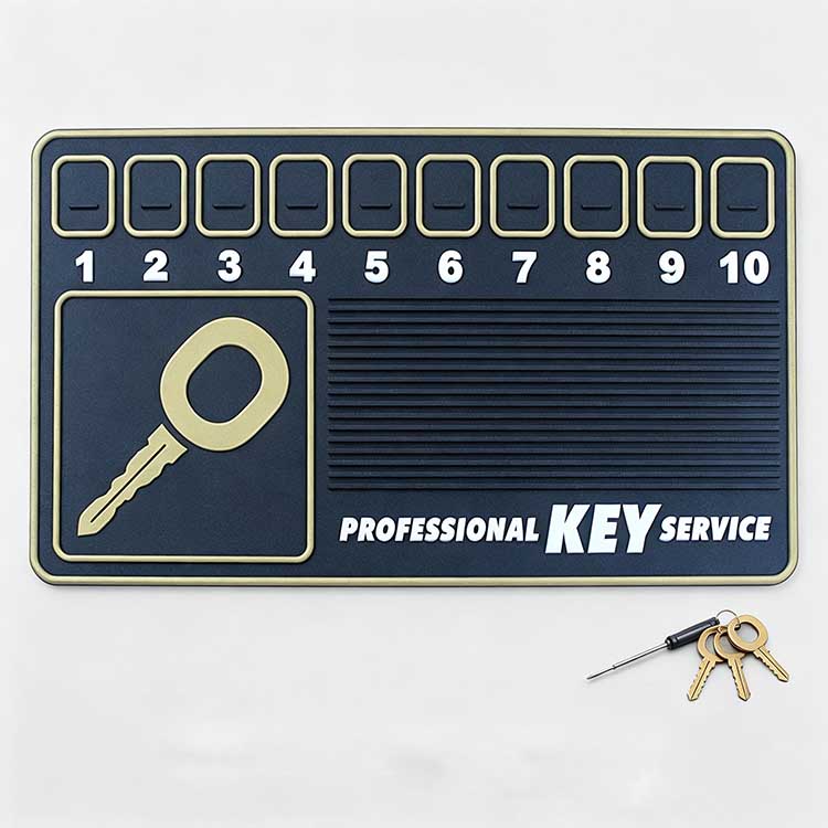 Close-up view of a key service mat featuring 10 numbered slots for organizing lock pins, springs, and key parts.