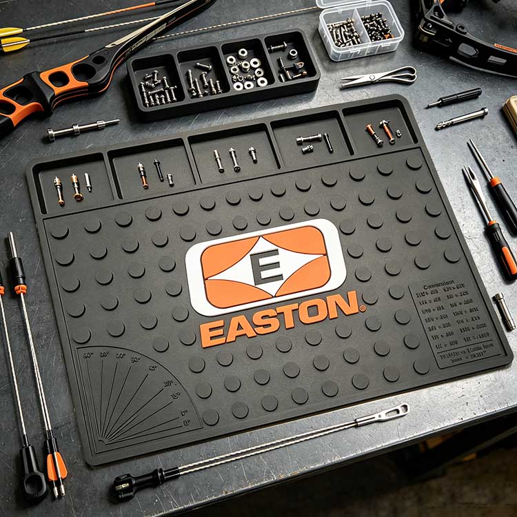 Studded non-slip grip texture on an archery mat preventing tools from sliding