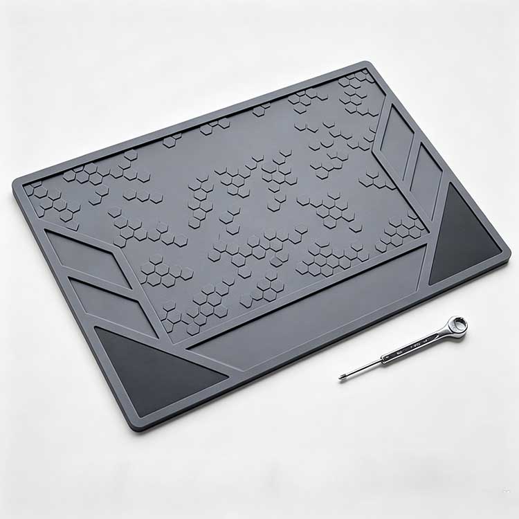 Geometric EDC tool mat with honeycomb grip texture and slanted storage compartments.