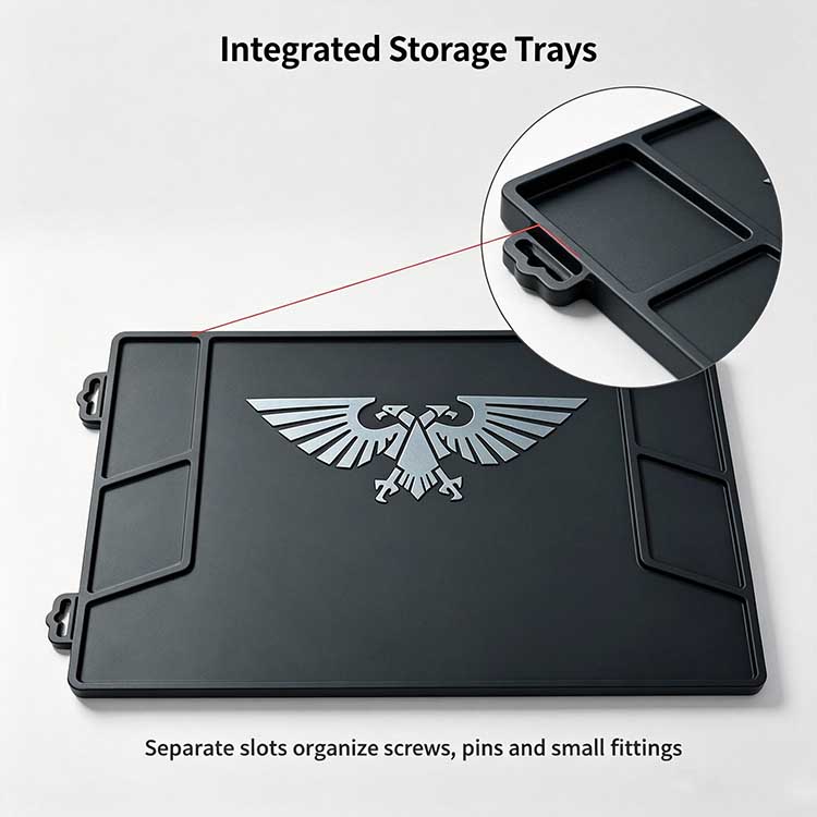 Angled storage bays on tool mat organizing screws and pins in symmetrical left and right compartments.