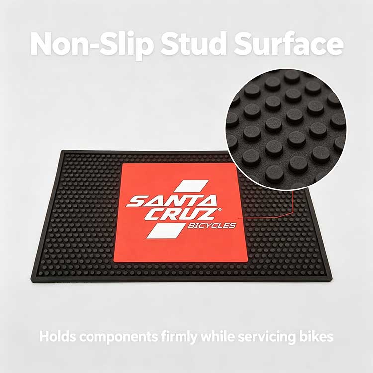 Close-up of the raised circular stud surface on the rubber benchtop mat providing maximum grip to prevent tools from sliding