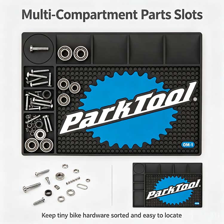 Multi-compartment parts slots on a bicycle tool mat sorting bearings and bolts.