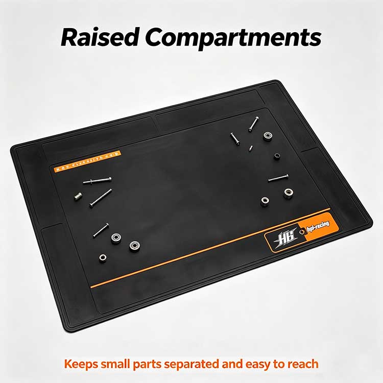 Raised edge compartments on a pit mat organizing small parts