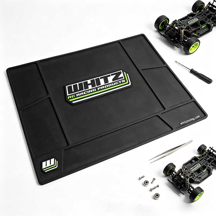 Large central workspace on an RC mat holding a full buggy chassis