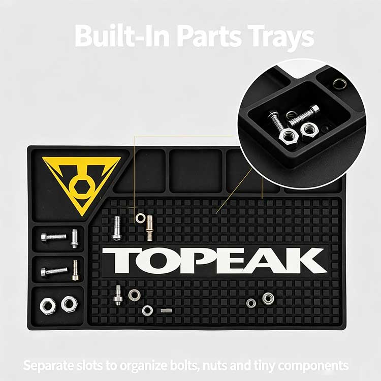 Built-in L-shaped parts trays on the bike workbench rubber mat organizing bolts, nuts, and tiny bicycle components