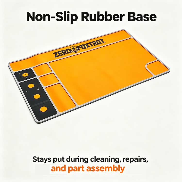 Non-slip rubber base on orange pistol cleaning mat.
