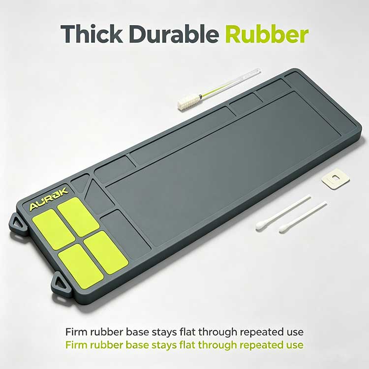 Rifle cleaning mat with integrated side hanging loops for portable storage.