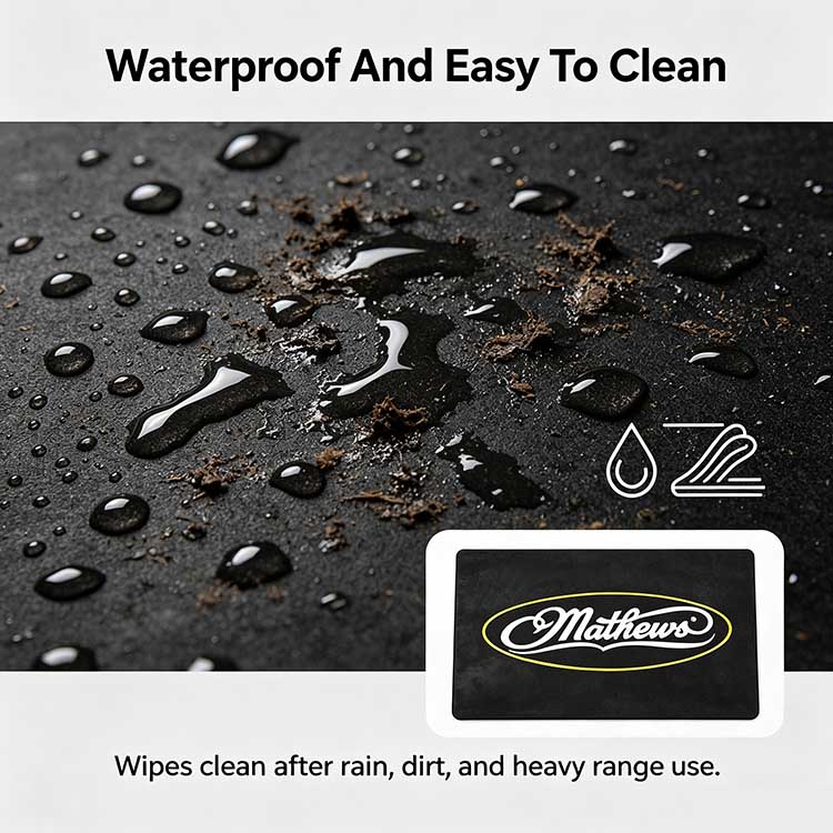 Close-up of waterproof black rubber archery range mat repelling water and dirt.