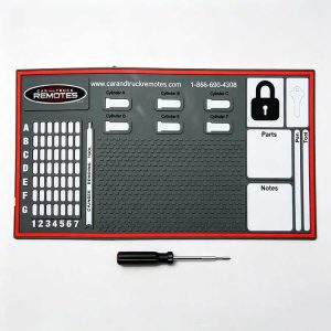 Rubber automotive locksmith tray with Cylinder A-F slots for car lock housings.