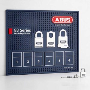 Padlock rekey mat with printed cylinder diagram for ABUS 83 series servicing.