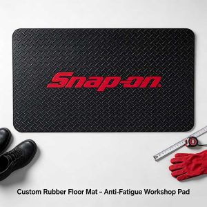 Precision-cut 24x36 inch heavy-duty rubber floor mat with custom 3D logo and measuring tape.
