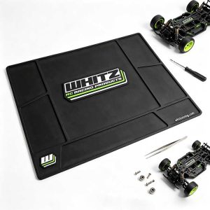 Large central workspace on an RC mat holding a full buggy chassis