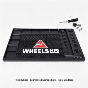 Premium thick rubber workbench mat with segmented storage slots and non-slip base, isolated on a white background