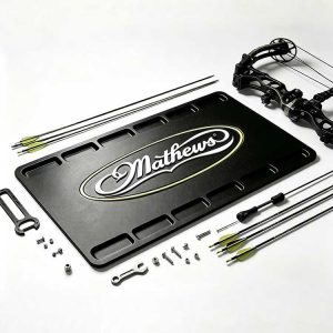 Black rubber bow building mat with edge slots for compound bow assembly.