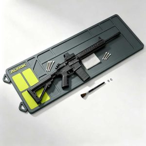 Extended rubber rifle cleaning mat supporting a full AR-15 and long gun.