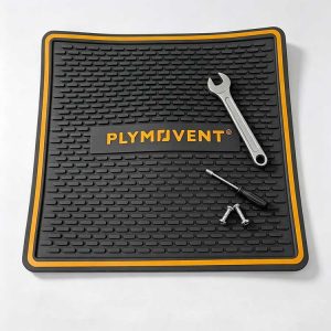 Heavy-duty silicone workbench mat with non-slip texture holding wrench screwdriver and screws.