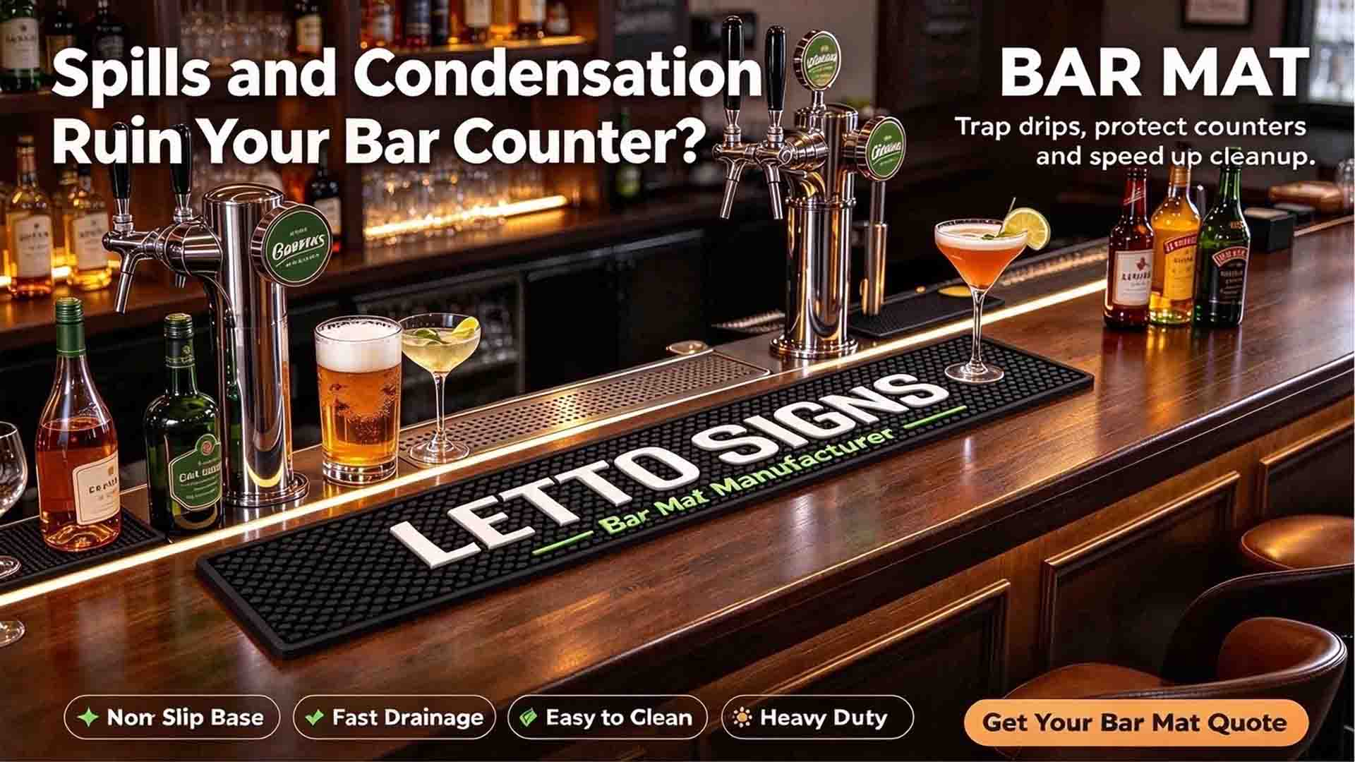 A custom black bar mat on a wooden pub counter with beer taps, featuring Letto Signs and a non-slip base to trap spills.